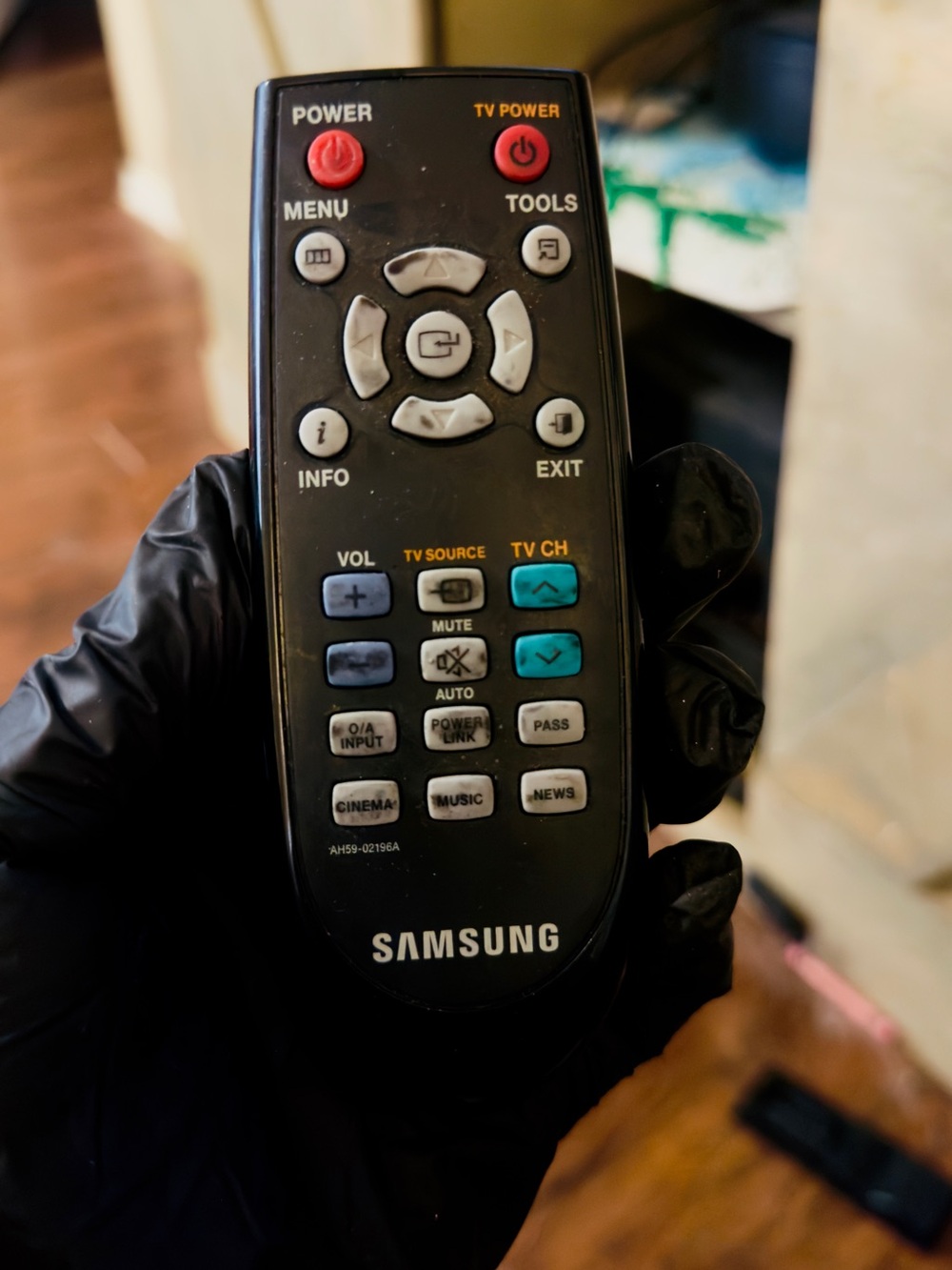 Samsung Black Remote with Red and Teal Function Buttons